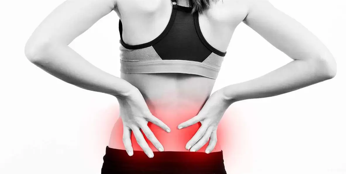 Pain in the lumbar region, which can be relieved with exercises and correct body position