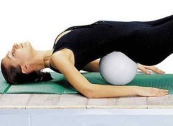 Exercise with a pillow under the lower back